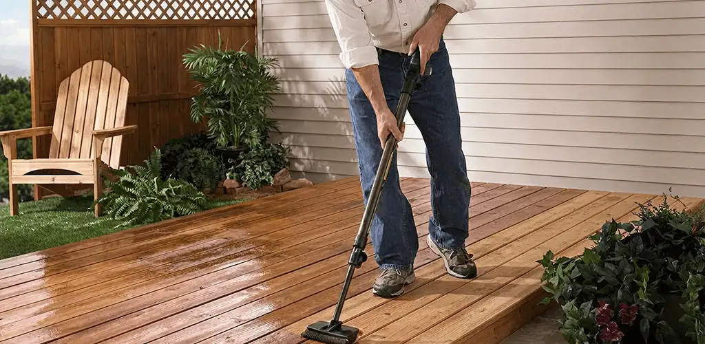 Deck staining service applying stain to a backyard wood deck in Toledo, OH